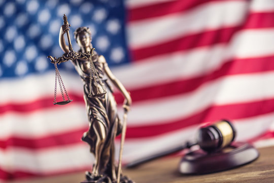 Lady Justice and American flag. Symbol of law and justice with USA Flag