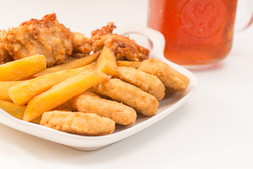 Chicken nuggets and ice tea on white background