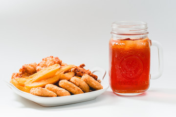 Chicken nuggets and ice tea on white background