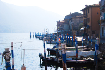 Fototapeta na wymiar Docking of small wooden boats in typical Italian style