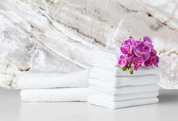 Obraz na płótnie Canvas Stack of folded white spa towels