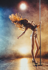 Fototapeta na wymiar Pole dancing woman