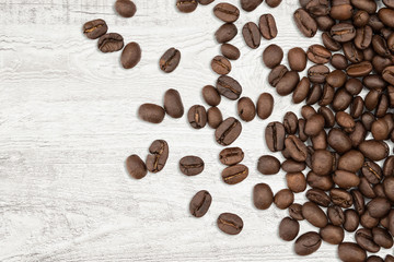 Close-up coffee beans on wood background.