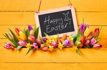 Happy Easter message with fresh spring tulips