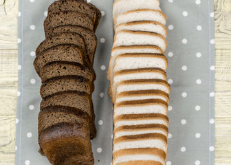 Sliced black and white bread.
