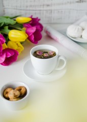 Beautiful flat lay with tea and flowers