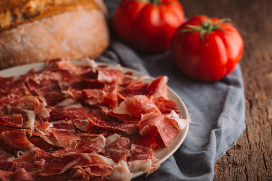 Typical spanish ham with tomatoes and bread