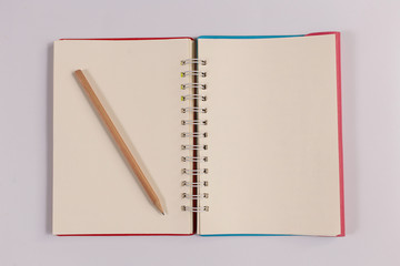notebook with brown pencil, office concept top view