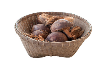 Coconut and dried coconut shell In the old wood basket. isolated on white background