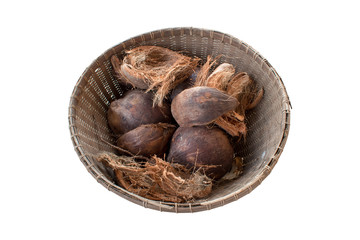 Coconut and dried coconut shell In the old wood basket.  top view isolated on white background