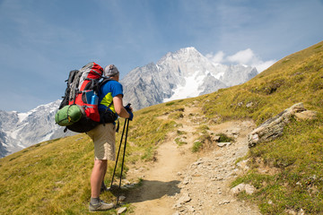 expedition to mountains with a tent and solar batteries
