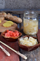 Pickled ginger slices and wooden chopsticks. Ingredient for sushi. Healthy food. Traditional Japanese condiment.