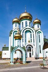 Fototapeta na wymiar Russian orthodox church with typical golden onion domes