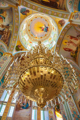 Obraz premium golden chandelier with candles in the Orthodox Church