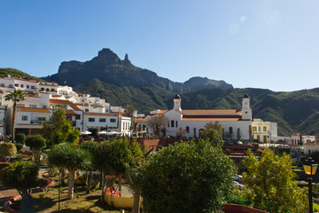 Fototapeta na wymiar Great views of Tejeda old town with Roque Nublo mountain on the background in Gran Canaria, Spain. Sunny day on iconic tourist destination. Summer vacation tour visit concept