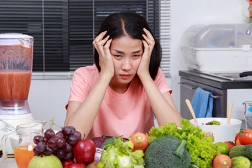 Photo sur Plexiglas Cuisinier depressed woman cooking in kitchen room