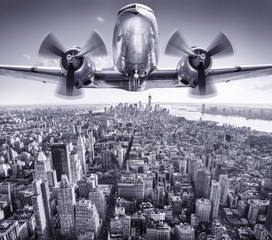 historic aircraft in the sky over manhattan