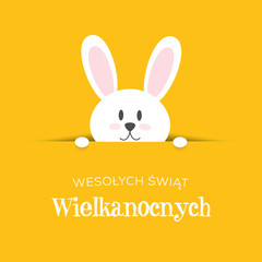 Fototapeta Wesołych Świąt Wielkanocnych, koncepcja kartki z życzeniami w języku polskim, króliczek wychyla się z nory obraz