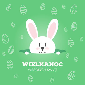 Wielkanoc Wesołych Świąt, koncepcja kartki z życzeniami w języku polskim, kr&oacute;liczek wychyla się z nory, w tle motyw z jajek wielkanocnych