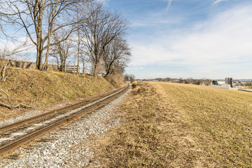 Fototapeta na wymiar Lonely Rail Road Track on a Winter Day