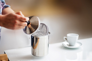 the girl is preparing morning coffee. the girl is preparing breakfast.