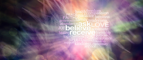 Ask believe receive word tag cloud -pink, orange and yellow feather effect bokeh background with...