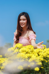 beautiful woman in chrysanthemum glower garden