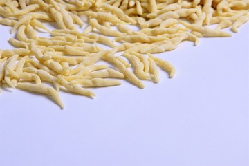 Fresh homemade pasta Italian trophy on a light background
