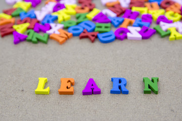 Word of LEARN on the background with colorful alphabet