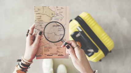 Woman holding world map travel concept