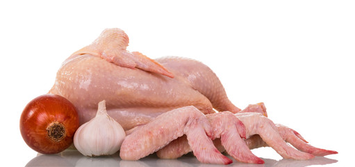 Whole Chicken carcass and wings, onion garlic, isolated on white