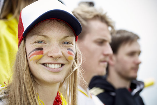 Portrait Of Football Supporter Smiling During Match