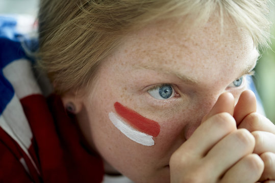 English soccer fan watching televised match