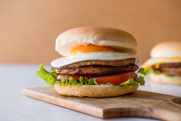 Homemade Double Hamburger with Egg, Lettuce and Tomatoes.