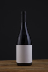 Isolated Red Wine Bottle in a Black Background