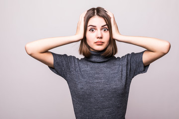Wrong doing. Portrait upset woman, slapping hand on head having duh moment isolated on gray...