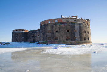 Old sea fort "Emperor Alexander the First" (Plague) on a sunny March day. Kronstadt, Russia