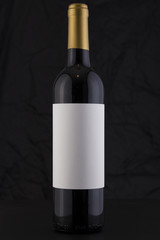 Isolated Red Wine Bottle in a Black Background