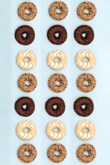 Fototapeta na wymiar lots of beautiful donuts on blue background