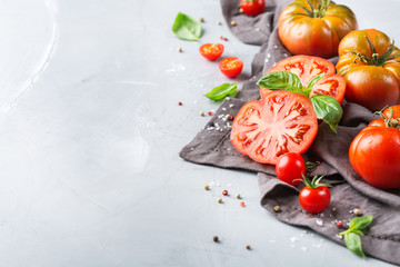 Assortment of ripe organic farmer red tomatoes on a table