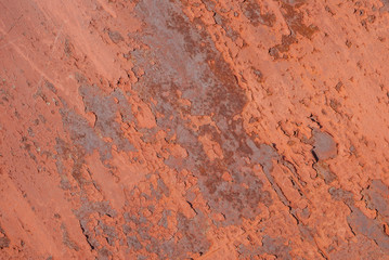 surface of rusty iron with remnants of old paint, chipped paint, red texture, background
