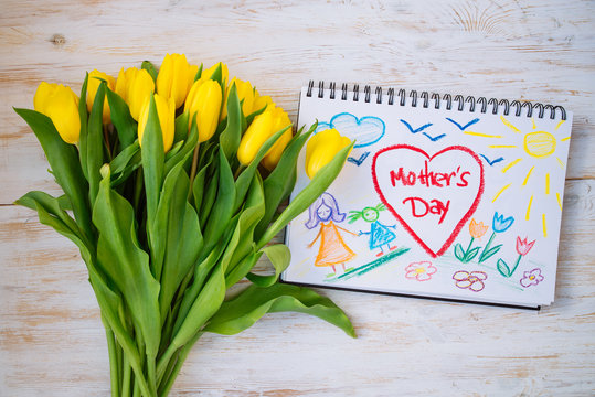 overhead view. mother day card with flowers on wooden background