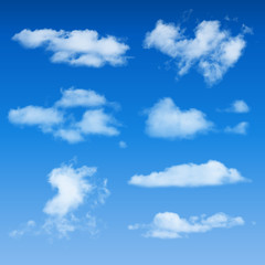 Naklejka na ściany i meble Clouds Shapes On Blue Sky Background