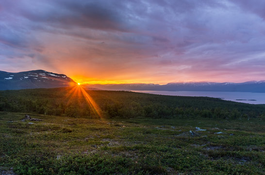 Midnight sun in summer in Abisko National Park, Sweden