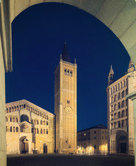 Fototapeta na wymiar Baptistery and cathedral of Parma illuminated at evening