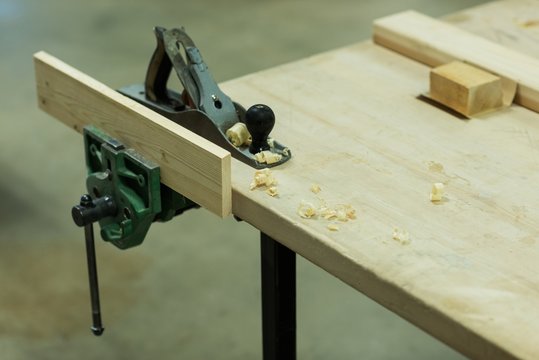 Jack plane with piece of wood on a table