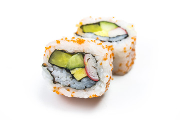 Sushi pieces placed between chopsticks, separated on white background. Popular sushi food.