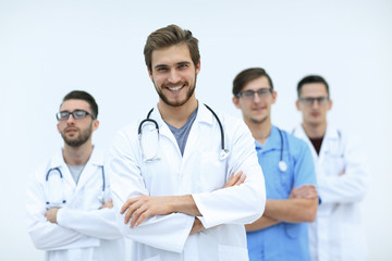 successful doctor in the background of the health care team