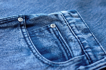 Blue jeans closeup view to abstract space of empty natural clean denim texture for traditional business background in cold bright colors