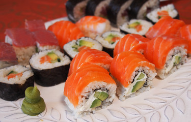 Philadelphia roll sushi with salmon, smoked eel, cucumber, avocado, cream cheese, red caviar. Sushi menu. Japanese food. Healthy food
